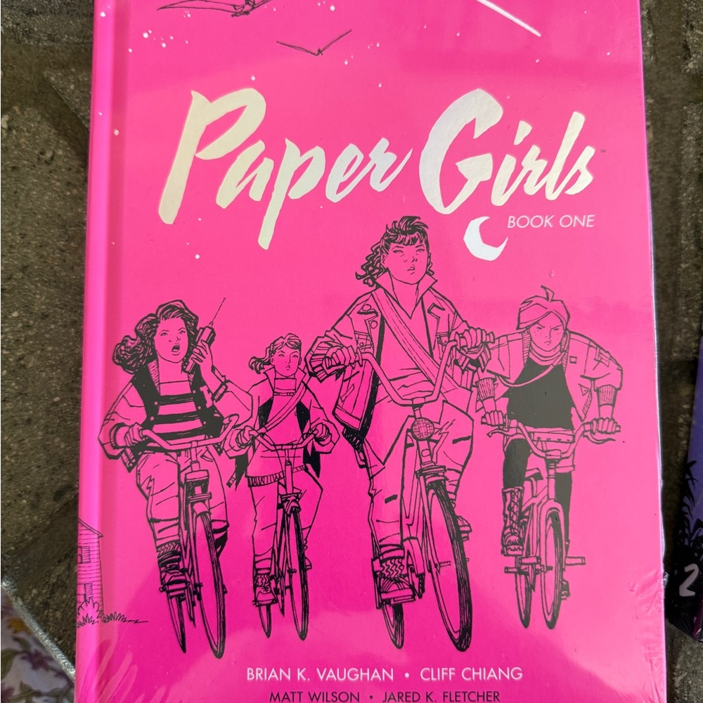 Paper Girls Graphic Novels, Book One & Two, hard covers, sealed.